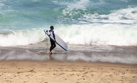 Surfer enjoys the waves of the ocean in Southern California in summerのeditorial素材