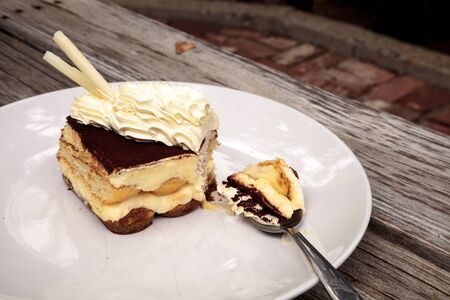 Creamy Italian tiramisu with a coffee flavored custard and ladyfingers layered with whipped eggs and mascarpone cheese infused with cocoa.の写真素材