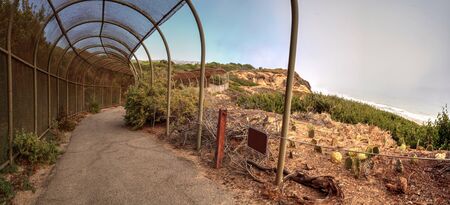 Walkway above the ocean at Crystal Cove state beach on the edge of Laguna Beach and Corona del Mar,...