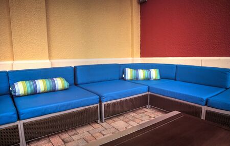 Tropical blue couch furniture with a view in summerの写真素材