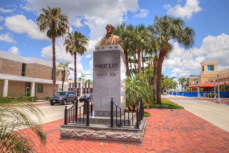 Fort Myers, Florida, USA â June 7, 2018: Clouds form in a blue sky above the controversial Robert E. Lee monument in downtown Fort Myers, Florida. Editorial use only.のeditorial素材