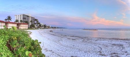 Lowdermilk Beach sunset over powder white sand in Naplesの写真素材