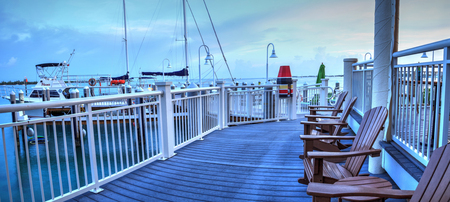 Key West, Florida, USA - September 1, 2018: Ocean view from bench on the dock at the Hyatt Centric...
