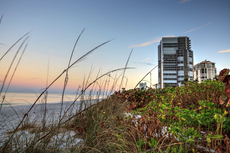 Sunrise over North Gulf Shore Beach along the coastline of Naples, Floridaの写真素材