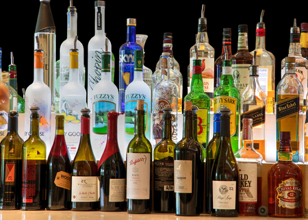 New York, New York, USA â December 31, 2000: Bottles of liquor and wine lined up in a fancy restaurant.のeditorial素材