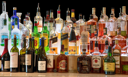 New York, New York, USA â December 31, 2000: Bottles of liquor and wine lined up in a fancy restaurant.のeditorial素材