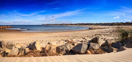 Blue skies over Corporation Beach in Dennis, Massachusetts on Cape Cod in the fall.の写真素材