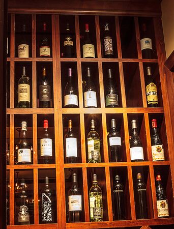 Los Angeles, California, USA â January 1, 2018: Wine bottles lined up and displayed in a wine cellar. Editorial use.のeditorial素材