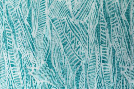 Aqua blue tropical fabric print background texture.