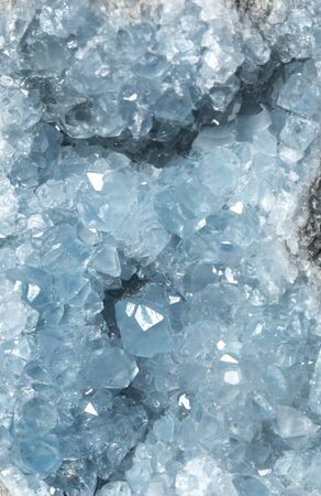 Blue celestite geode crystal background texture.