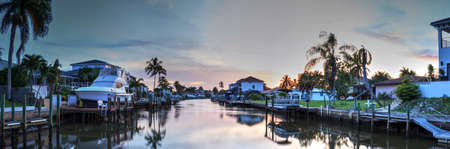 Waterway leading to the Ocean near Vanderbilt Beach in Naples, Florida at sunset.のeditorial素材