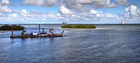 Bonita Beach, Florida, USA â November 16, 2020: The dredging of New Pass under Big Hickory Bridge in Bonita Springs so that Estero Bay has better access to the ocean.のeditorial素材