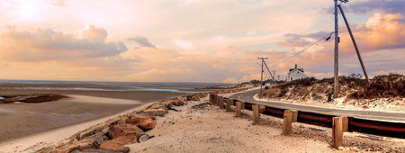Roadway along Chapin Beach in Cape Cod, Massachusetts at sunset.の写真素材