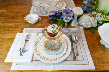 Gourmet cupcake in a crystal compote etched in 24k gold on a formal table at Easter.