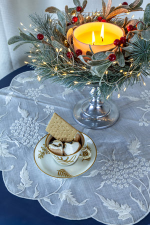 Gourmet hot chocolate with sâmores including marshmallows, graham crackers, and chocolate in an antique gold cup.の写真素材