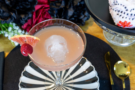 Grapefruit margarita on a black plate on a decorated table.の写真素材