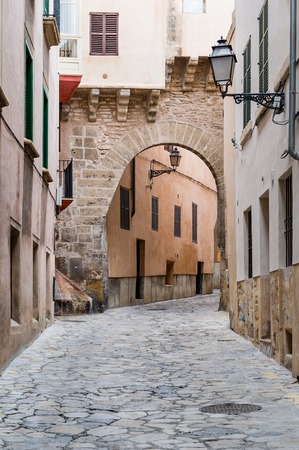 Arched narrow street in old mediterranean townの写真素材