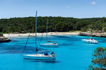 Charter boat anchorage at Cala Mandrago, Mallorca Islandの写真素材