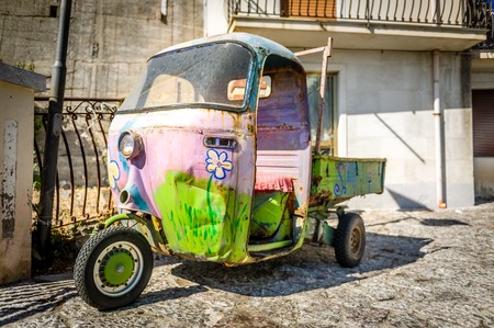 Hippy retro car. Taormina narrow streets, Sicily, Italyの写真素材