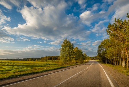 Landscape with empty road in good weather and morning lightの写真素材