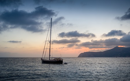 Classic sailing boat stay at anchor in Ibiza island bay