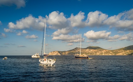 Sailing yachts stays at anchor in Mediterranean sea bay. Balearic islands, Spainの写真素材