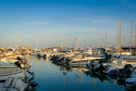 Many fishing boats stays at bertch in Eivissa, Spainの写真素材