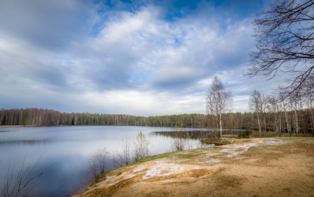Beautiful and cold october day at Russian forest lakeの写真素材