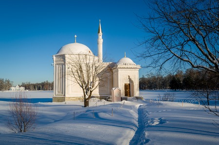Small mosque church at snowy landscape in sunny winter day. Russia.の写真素材