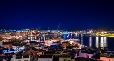 Night colorful view of Ibiza old town and harbourの写真素材