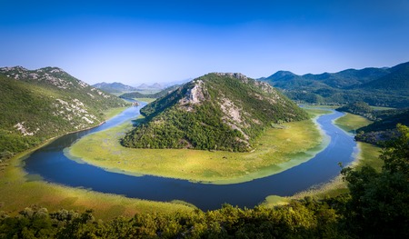One of the most famous views of Montenegro. Canyon of river Crnojevica, where it makes a turn over the green mountain. Rijeka Crnojevica, Montenegro.の写真素材