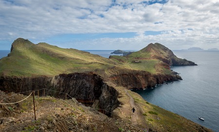 Traveler woman doing her hike at Madeira island eastern trail route. Beautiful landscapes of Madeira, Portugal.の写真素材