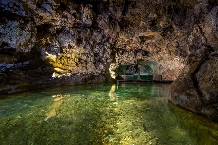 Underground lake inside the natural volcanic caves. Sao Vicence, Madeira island, Portugal.の写真素材