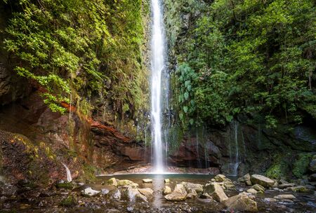 Big waterfall in the final point of popular hiking route levada 25 fontes. Rabacal, Madeira island, Portugal.の写真素材