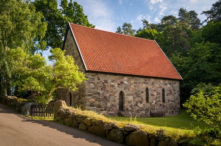 Lovoy old stone chapel on the spring's water source. Falkensten, Norway.の写真素材