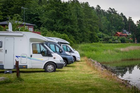 Auto campers parked at lake's shore. Lovoy island camping, Norway.の写真素材