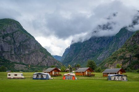 Evening at beautiful norwegian camping site at the fjord shore. Eidfjord, Hordaland, Norway.の写真素材