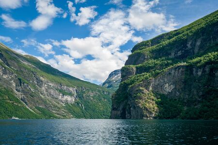 Geiranger fjord rocky shores with steep mountain slopes. Geirangerfjord, Norway.の写真素材