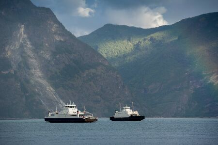 Two ferries at norwegian fjordの写真素材