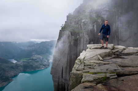 Tourist on Prekestolen rockの写真素材