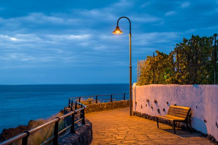 Night lantern on the ocean shoreの写真素材