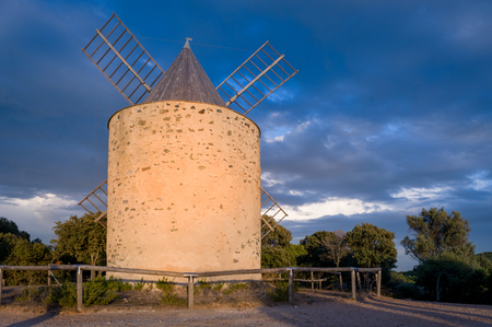 Windmill at Porquerolles island. Evening beautiful light.の写真素材