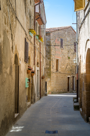 Narro streets of Pitigliano old town. Medieval village in the fortress on the rocks. Tuscany, Italy.の写真素材