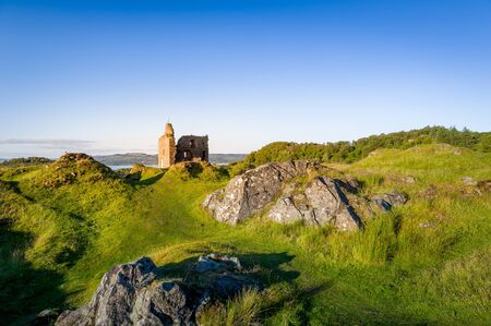 Rocky landscape of Tarbert at sunset light. Terbert, Scotland.