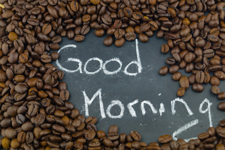 many brown roasted beans for a fresh cup of coffeeの写真素材
