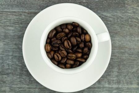 many brown roasted beans for a fresh cup of coffee