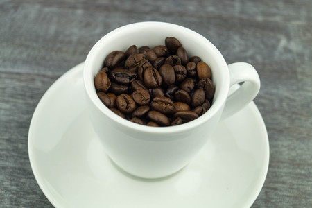 many brown roasted beans for a fresh cup of coffee