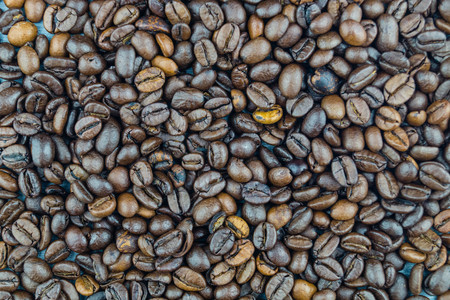 many brown roasted beans for a fresh cup of coffeeの写真素材