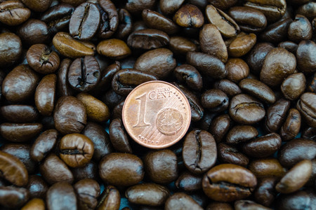 fair trade coffee price - roasted coffee beans and money