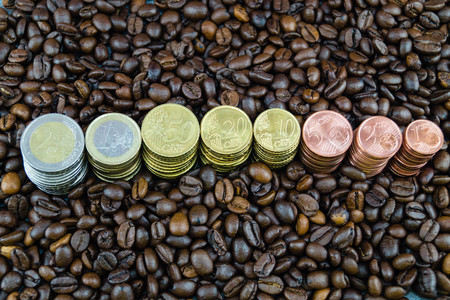 fair trade coffee price - roasted coffee beans and money